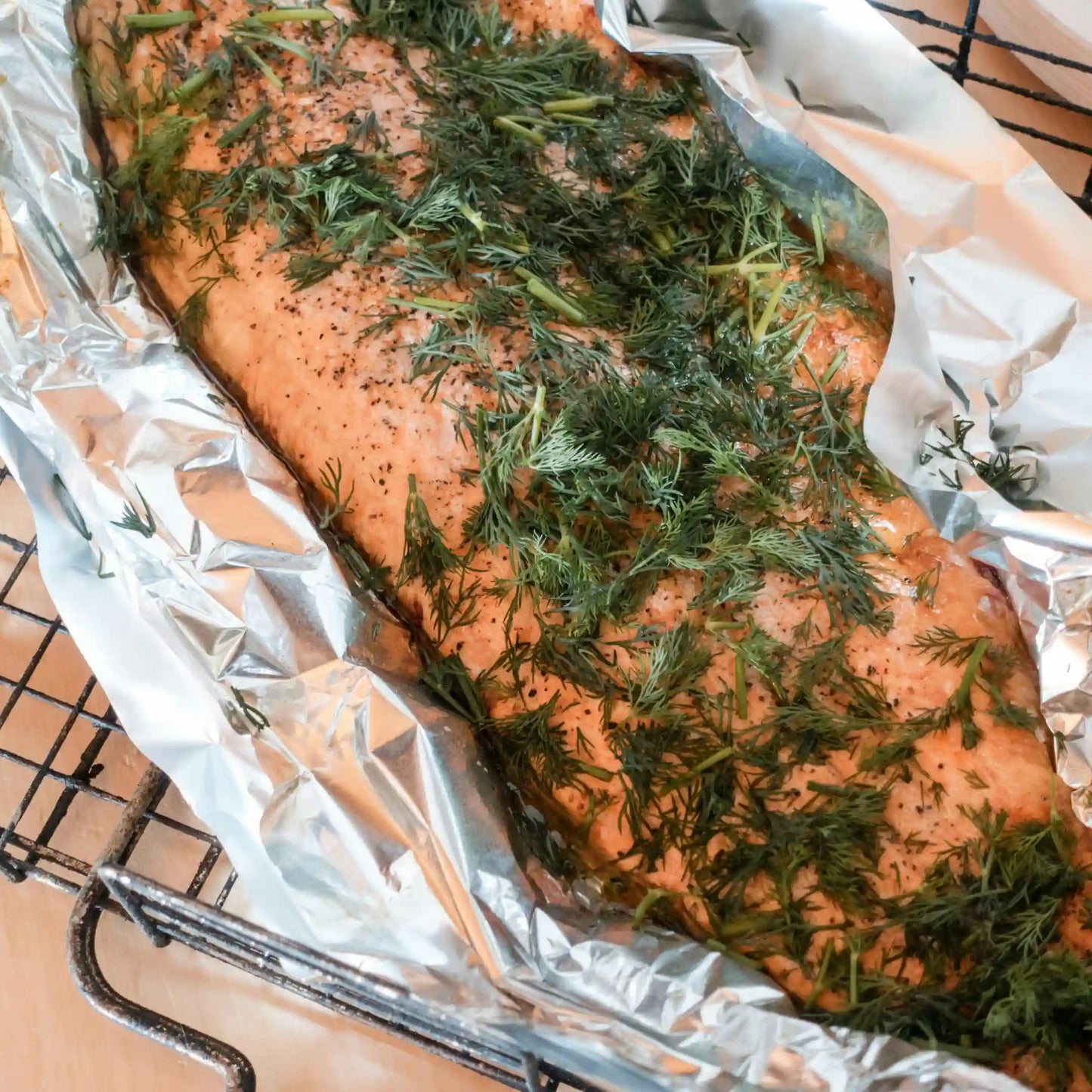 Pescado preparado para cocinar en el horno y envuelto con papel de aluminio profesional en Gran Canaria